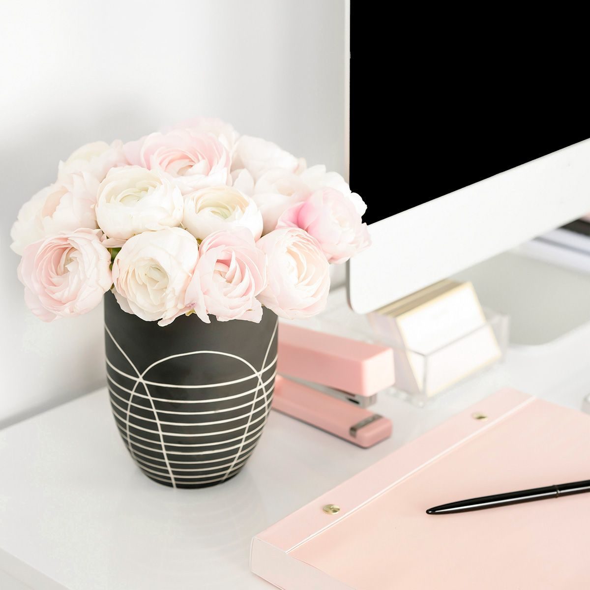 Computer and flower on a desk